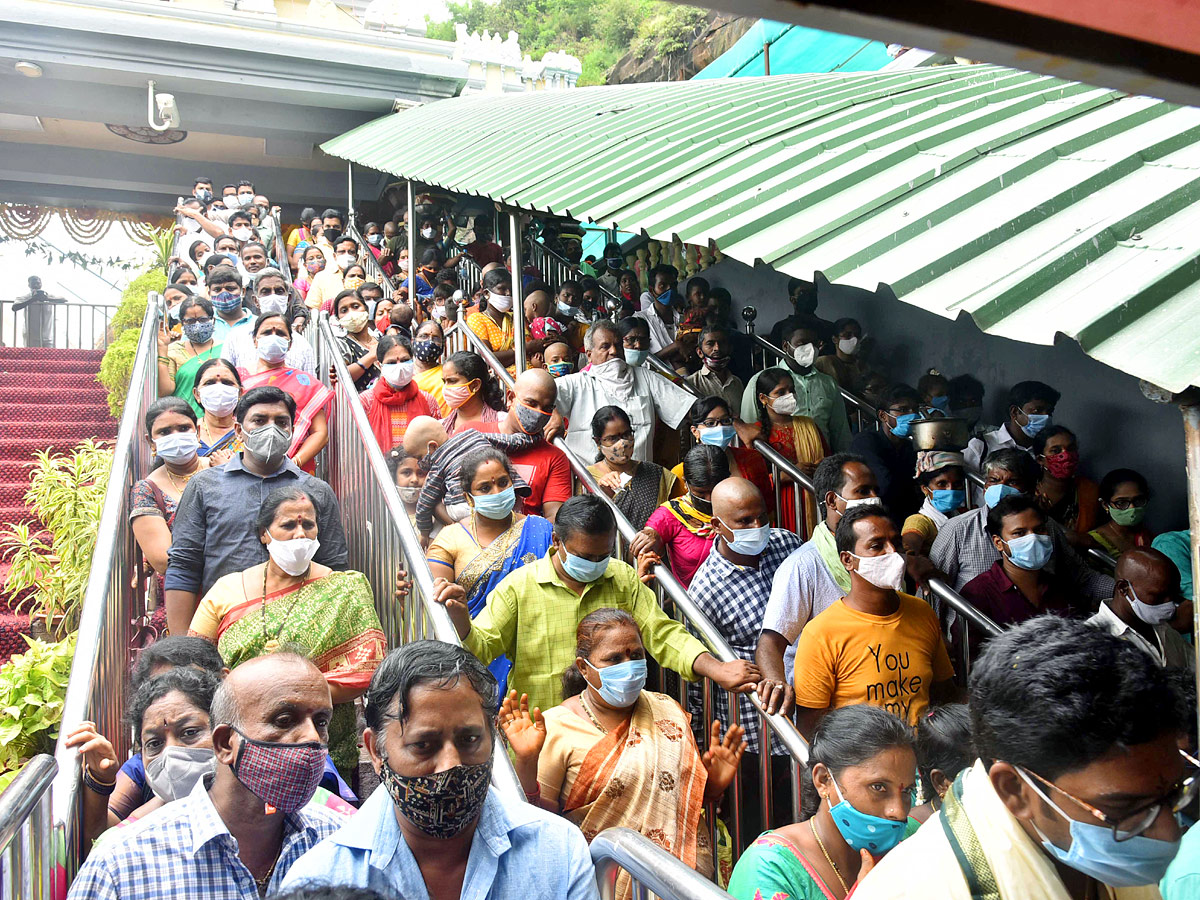 Devotees Rush On The Occasion Of Sravana Masam in Indrakeeladri - Sakshi