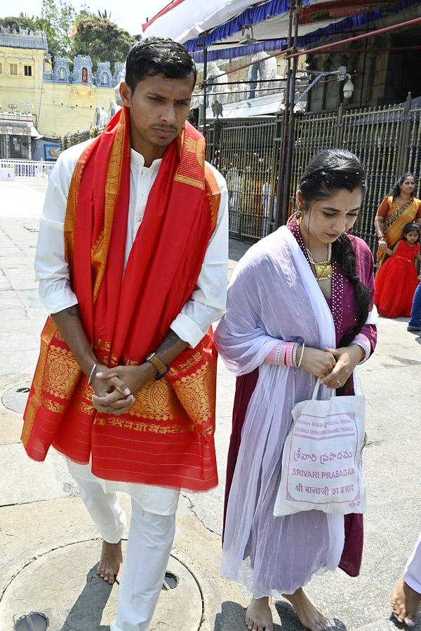 Cricketer Navdeep Saini visits Tirumala With His Wife Photos - Sakshi