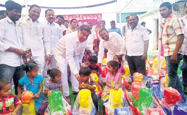 toys distribution in anganwadi school - Sakshi