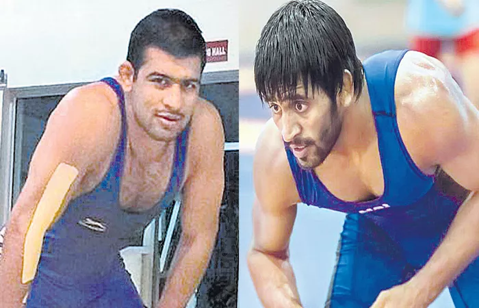 Bronze medals were achieved the Bajrang punia and vinod - Sakshi