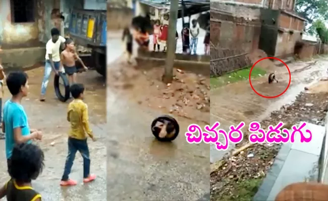 Boy Rolls Around The Street In A Tyre Viral - Sakshi