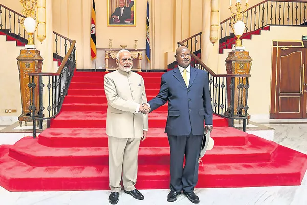 PM Modi arrives in Uganda, meets President Yoweri K Museveni - Sakshi