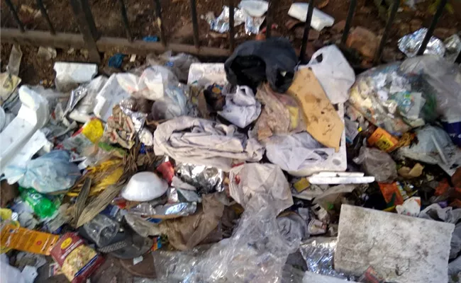 Garbage dumpes on a walkway near Panjagutta  - Sakshi