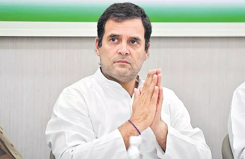 rahul gandhi firm on quitting workers urge him to take back resignation - Sakshi