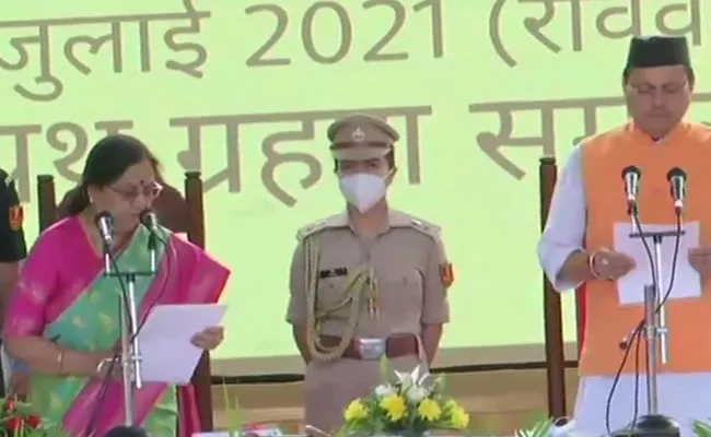 Pushkar Singh Dhami Takes Oath As Uttarakhand CM - Sakshi