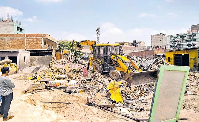 Telangana: Crackdown On Illegal Constructions Continues In HMDA Limits - Sakshi