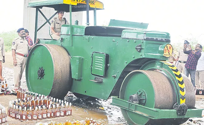 Ongole: Seized Liquor Bottles Worth Rs 2 Crore Crushed Under Road Roller - Sakshi