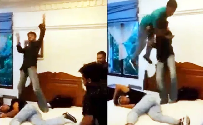 Sri Lanka Protesters Wrestling on PM Bed Video goes Viral on Social Media - Sakshi