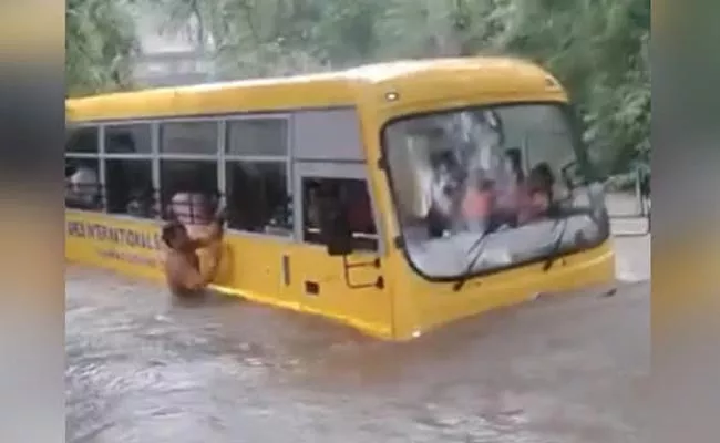 School Bus Carrying 24 Children Stuck In Large Drain At Madya Pradesh - Sakshi