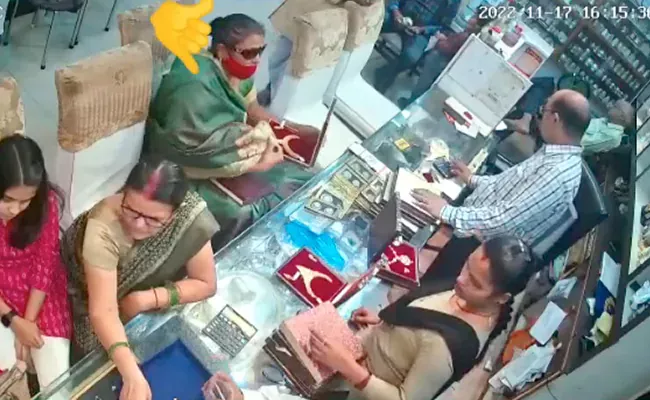 Viral Video: Woman In Busy UP Store Steals Necklace Worth Lakhs - Sakshi