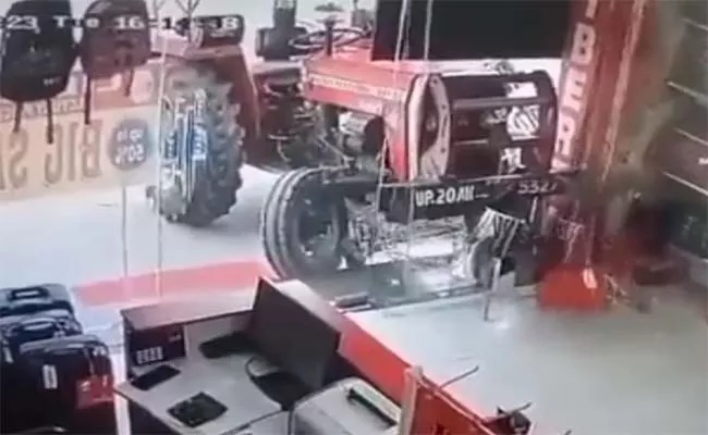 Virla Video: Tractor Starting On Its Own And Rams Into UP Shop - Sakshi