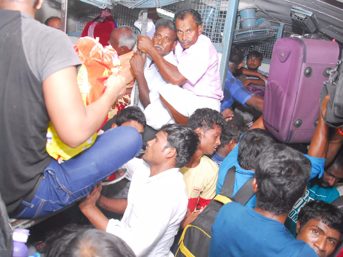 Railway stations and bus stations teeming with crowd Phot Gallery - Sakshi